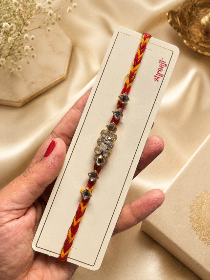 Moli Rakhi with a silver crystal flower