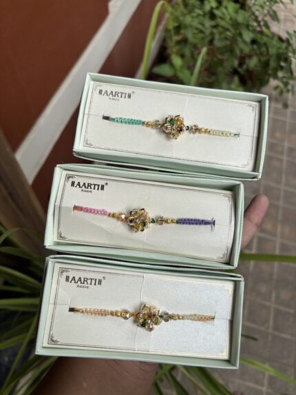 AD Multi Thread Rotating Flower Rakhi