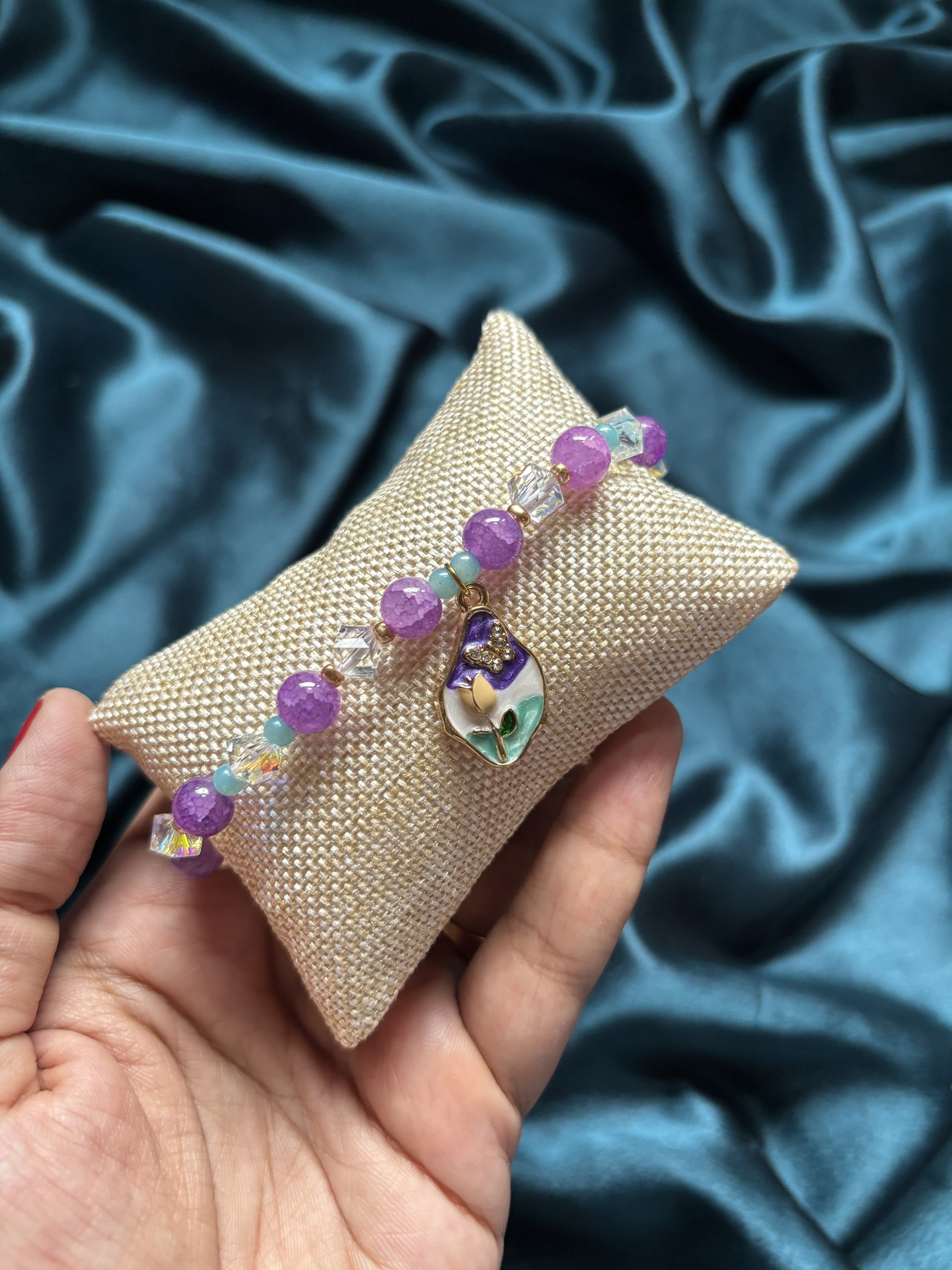 Bracelet rakhi with an meenakari enamel charm